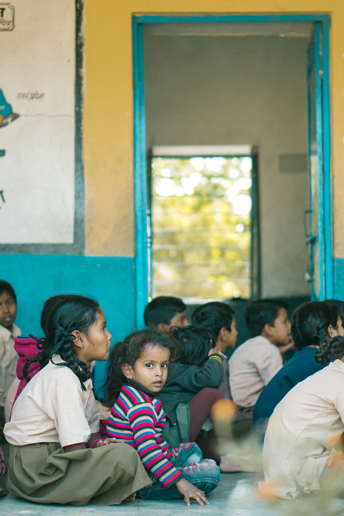 Children actively participating in a lesson in an Indian school classroom