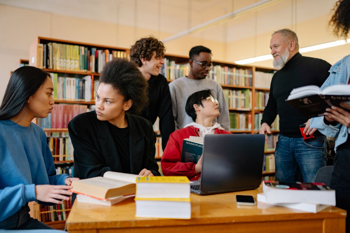 A diverse group of students studying together at a university library